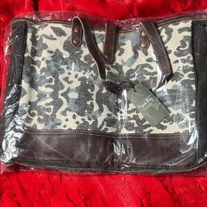 Myra Bag Dark Brown and Tan Tote w a small had bag or makeup bag so it’s a set